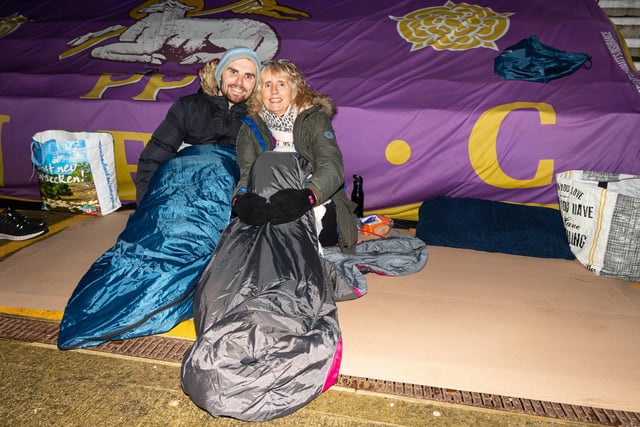 Jordan and Lisa Philipson get close to each other to keep warm during the PNE Sleep Out at Deepdale. Photo: Kelvin Lister-Stuttard