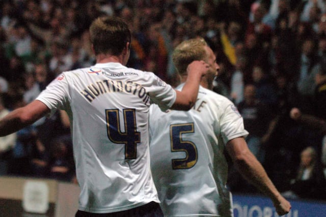 Tom Clarke celebrates with Paul Huntington after scoring PNE's winner against Blackpool in August 2013