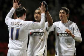 Leon Clarke celebrates scoring for Preston with Keith Treacy and Adam Barton