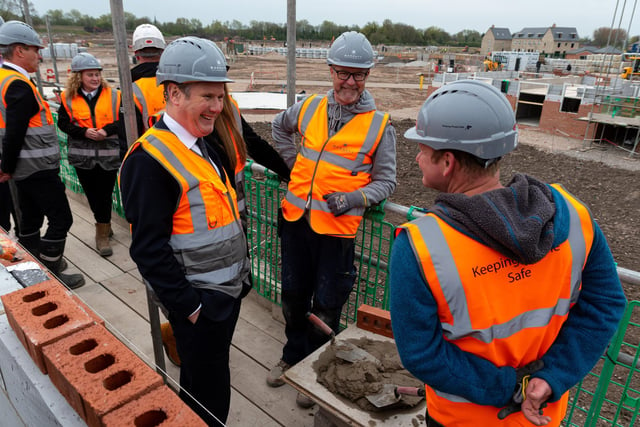 Labour leader Sir Keir Starmer chats with builders during a visit to a Leyland housing development with Deputy Leader Angela Raynor.  Photo: Kelvin Stuttard