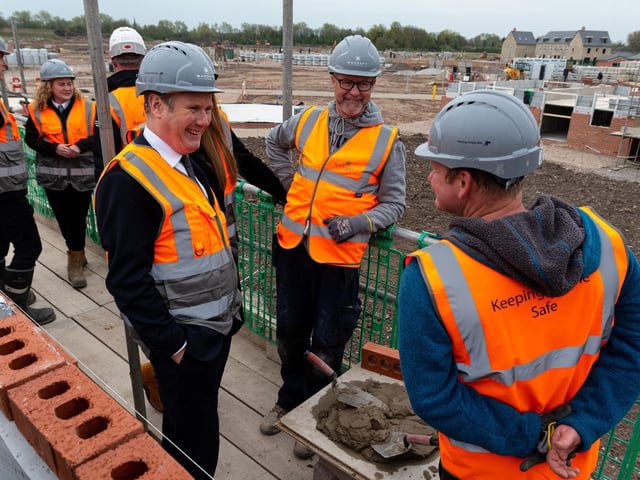 Labour leader Sir Keir Starmer chats with builders during a visit to a Leyland housing development with Deputy Leader Angela Raynor.  Photo: Kelvin Stuttard