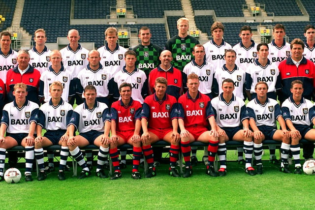 Most of the 1996 Preston North End squad, pictured with management - (Back left to right): Steve Wilkinson, Russ Wilcox, Andy Saville, Neil McDonald, David Lucas, Tuevo Moilanen, Jamie Squires, Kevin Kilbane, Ryan Kidd, Paul Sparrow. (Middle left to right) Alan Fogarty (chief scout), Gil Brooks, Ray Sharp, Michael Holt, Mick Rathbone (physio), Gary Bennett, Tony Grant, Simon Davey, Allan Smart, Paul Compton (youth development officer). (Front  left to right) Kevin Gage, Lee Cartwright, Steve Harrison (first team coach), Gary Peters (manager), David Moyes (assistant manager), Ian Bryson, Dean Barrick, Graeme Atkinson