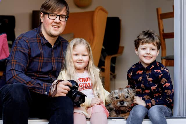 Si Miller with daughter Elsie, five, Biffy the border terrier, and son Arthur, seven. Photo: Si Miller Photography