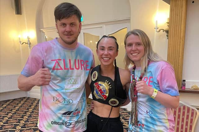 New British champion Eleanor Fellows (centre) with head coaches Alice and Tommy Johnson