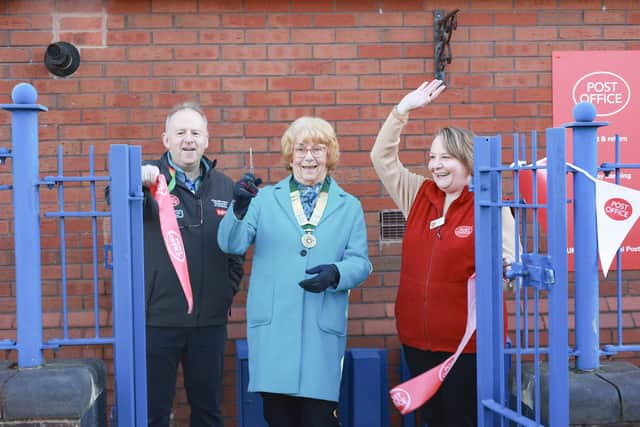 Lea and Cottam Parish Council vice chair Christne Abram does the honours to mark Cottam Post Office making the community centre its permanent home