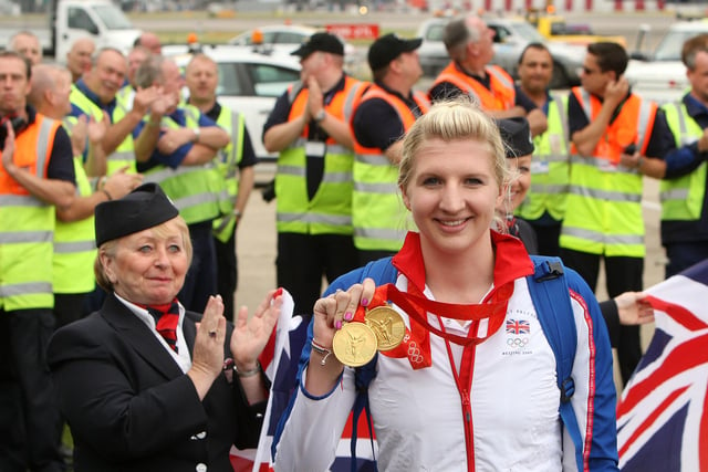 Staff from Heathrow Airport applaud double gold Medalist swimmer, Rebecca Adlington. Brilliantly Becky  set a new British, Commonwealth, European and Olympic record  in the preliminary heats of the 800m freestyle, before going one step further in the final.