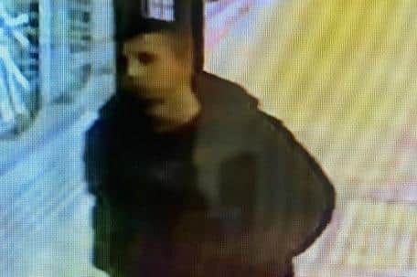 Police want to speak to this man after a car was stolen from the multi-storey car park at Preston railway station (Credit: British Transport Police)