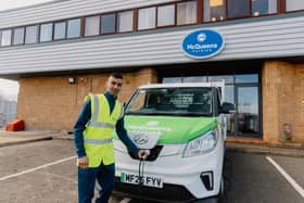 (Zeishan Mehmood plugging in McQueens new electric van)