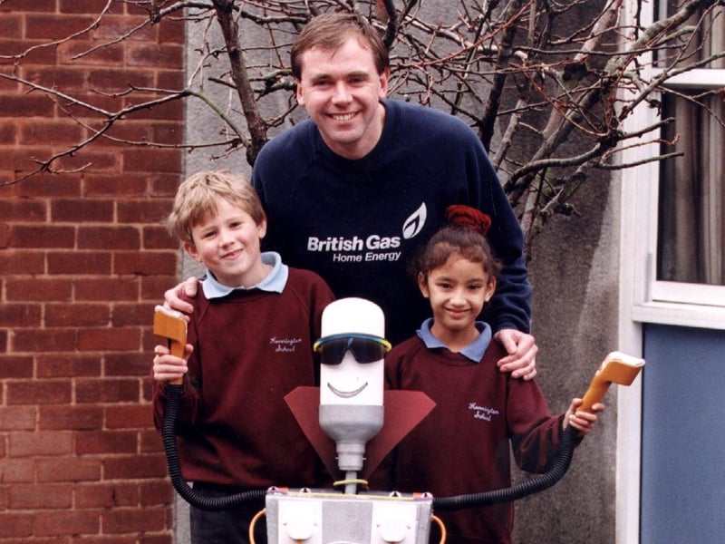 Michael Hoyle and Chloe Kaur, both aged seven, of Kennington County Primary School, meet 'Saver' the energy saving robot with Philip Wilcock of British Gas