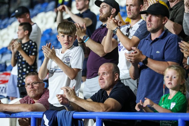 A couple of young PNE fans watch their side.