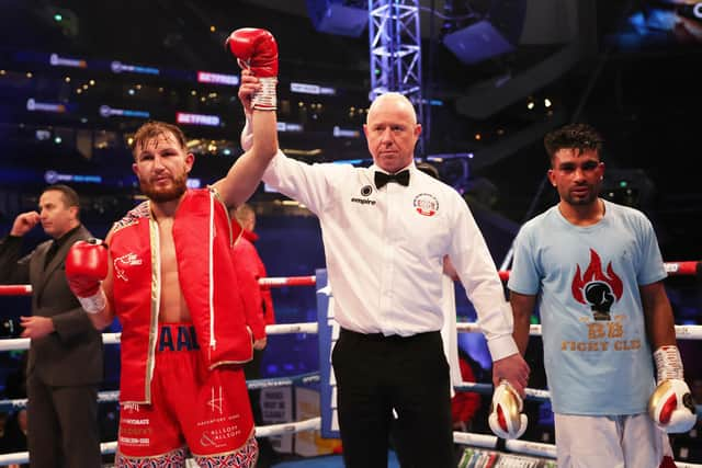 Isaac Lowe celebrates victory against Sandeep Singh Bhatti