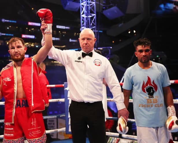 Isaac Lowe celebrates victory against Sandeep Singh Bhatti