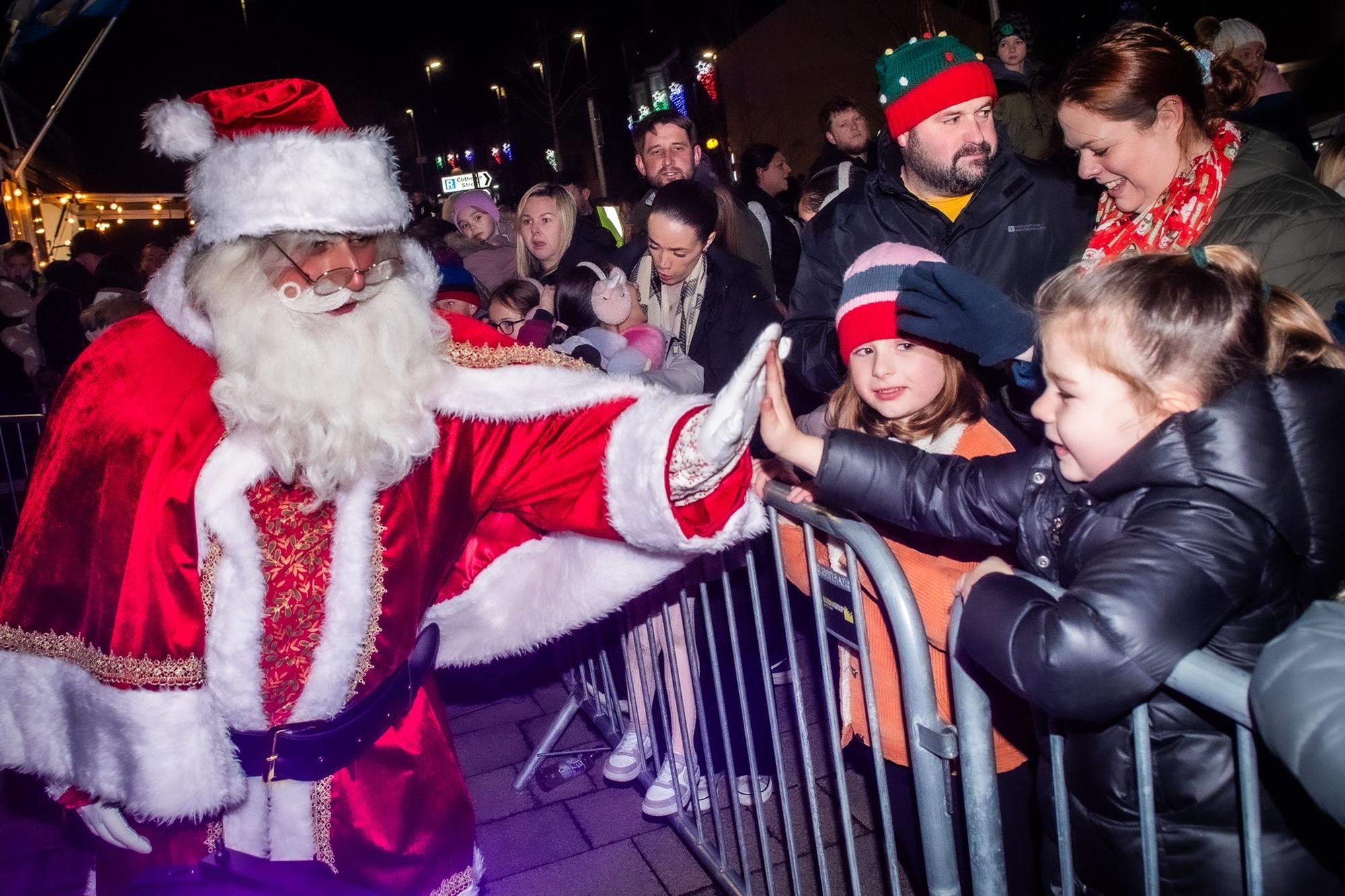 Father Christmas receives a warm welcome to the Padiham Christmas lights switch on