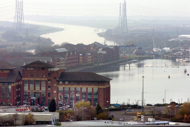 Shrouded in fog and looking moody is Preston docks and the River Ribble. This image was taken from the top of St Walburge's church spire in 2004