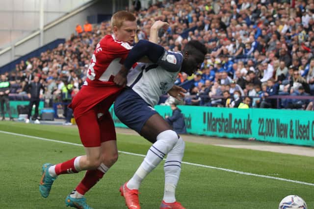 Preston North End defender Bambo Diaby holds off a challenge from Middlesbrough; Duncan Watmore