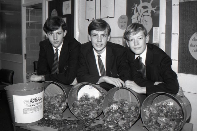 Caring pupils at All Hallows RC School, Penwortham, raised £400 for Wythenshawe Hospital's New Heart, New Start appeal by emptying their pockets and collecting 20,000 2p pieces. Pictured are Anthony Ward, James Sandwell and Peter McCann with the bags full of 2p pieces