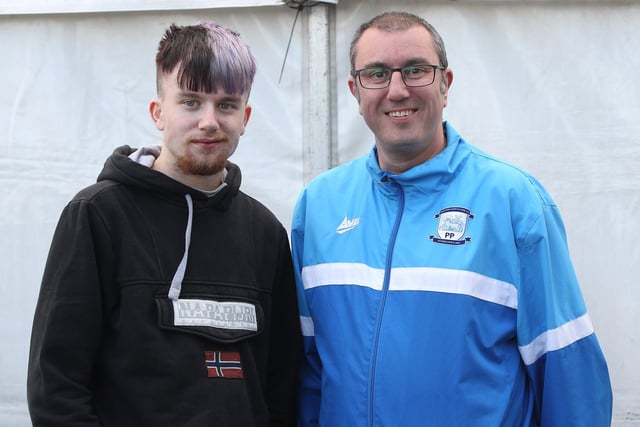 Two North End fans enjoy the fan zone as they wait for the game against Rovers to kick off.