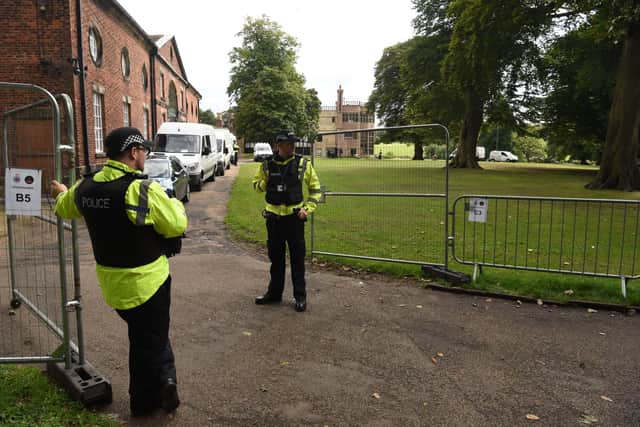 Police guarding one of the entrances to Astley Hall prior to the G7 Speakers' Summit - additional duties that generated a big overtime bill, which the government has now agreed to cover