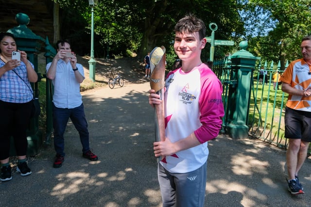 Montgomery-Everard Lord proudly holds the baton