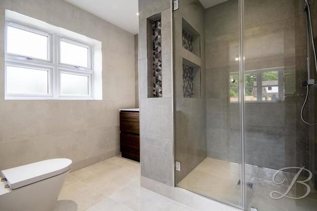 The en suite to the second bedroom is so terrific it would pass as the main shower room in most homes. A tiled suite comprises a vanity unit, enclosed shower cubicle, heated towel-rail, low-flush WC and illuminated mirror.
