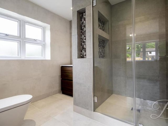 The en suite to the second bedroom is so terrific it would pass as the main shower room in most homes. A tiled suite comprises a vanity unit, enclosed shower cubicle, heated towel-rail, low-flush WC and illuminated mirror.