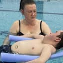 Homecare Assistant Jackie McPherson taking client Xavier Spragg swimming