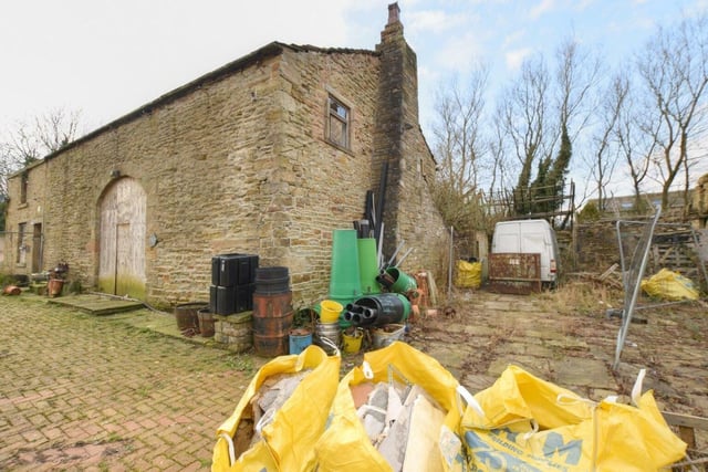 A derelict Burnley farmhouse in Burnley is due under the auctioneer's hammer