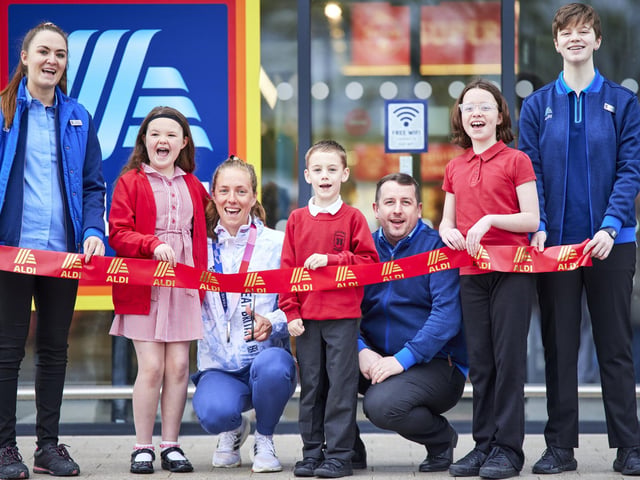 Manager Liam Morris and Team GB athlete Josie Knight welcome customers to the new store. from left: Isabelle 8, Alfie 7 and Willow 10.