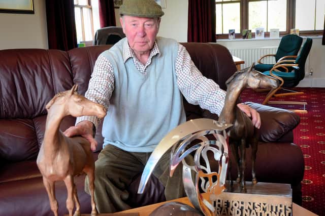 Trevor Hemmings with his unique collection of three Grand National trophies