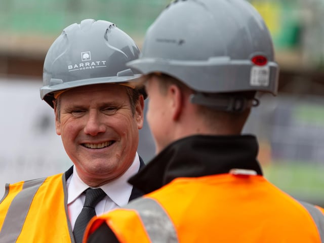 Labour leader Sir Keir Starmer chats with apprentice joiner Lucas Worswick during a visit to a Leyland housing development with Deputy Leader Angela Raynor.  Photo: Kelvin Stuttard