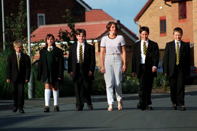 Campaigning mum Yvonne Casey prepares to walk to Broughton High School with pupils (from lefto right) Mark Casey 11,  Stephanie Clement 11, Adam Schofield 12, David Blackburn 11, and Daniel Taylor-Morris 11, because there is no bus service from their estate near Longsands Lane in Fulwood