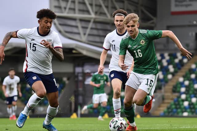 PNE's Ali McCann battles for possession with the United States' Chris Richards while playing for Northern Ireland. Pic: Getty Images
