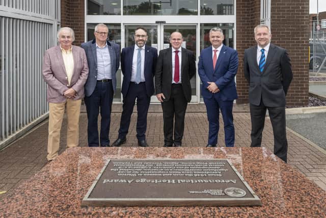 Two Royal Aeronautical Society (RAeS) heritage plaques have been awarded to BAE Systems to mark its contribution to aviation development.
Pictured from left to right: Alan Matthews, RAeS Preston Secretary, Martin Rayfield RAeS Preston Treasurer, Mike Elston, Chairman of RAeS Preston branch, Dave Holmes, BAE Systems Technology and Manufacturing Director, Dave Edwards, RAeS CEO and Scott Phillips RAeS Head of Community Engagement