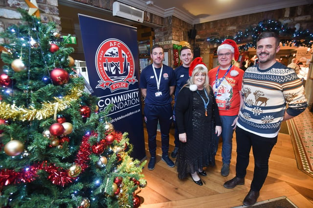 Free Christmas lunch at the Toby Carvery in St Annes. Organisers L-R Lee Geraghty and Bailey Wright from the AFC Fylde Community Foundation with manager Janette Marsh, assistant manager Mike Carr and PCSO Trevor Sterling.