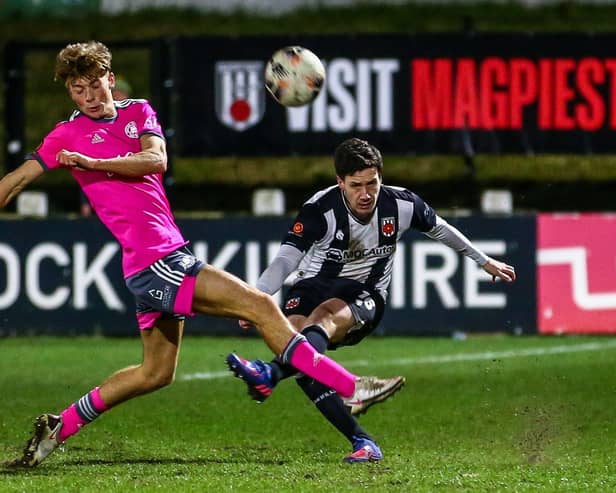 Adam Blakeman plays the ball down the line against Boston United (photo: Stefan Willoughby)