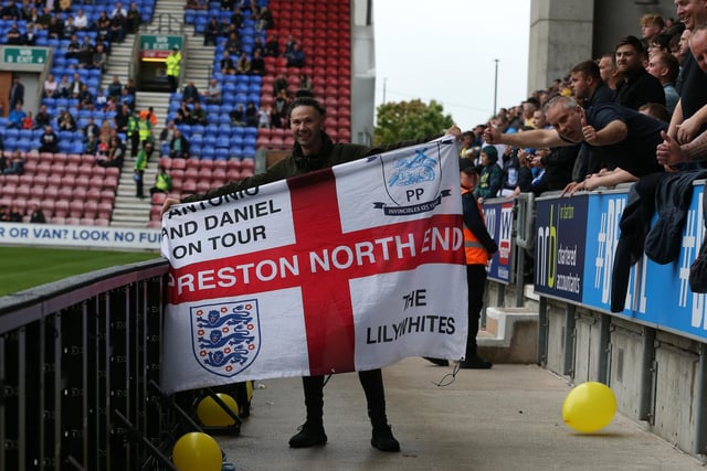 A PNE fan shows off his flag.