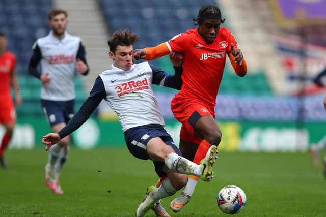 PRESTON, ENGLAND - MARCH 20: Pelly Ruddock Mpanzu of Luton Town and Ryan Ledson of Preston North End battle for the ball during the Sky Bet Championship match between Preston North End and Luton Town at Deepdale on March 20, 2021 in Preston, England. (Photo by Alex Livesey/Getty Images)