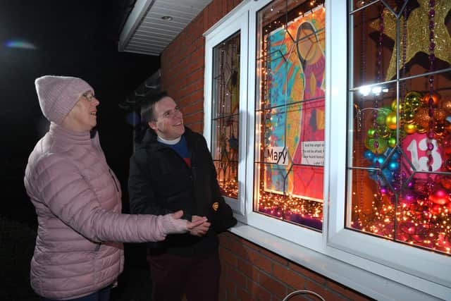 Photo Neil Cross; New Longton turns into advent calendar as 24 houses are lighting up a window with a theme throughout December. Lay preacher Carolyn Hothersall and Rev'd Tom Wolford