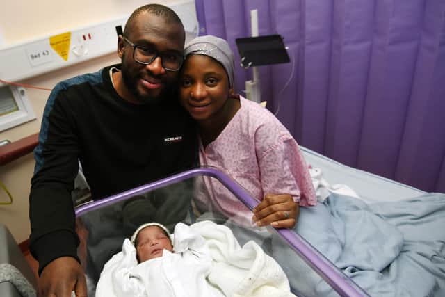 Parents Dr Abdullahi Giza (left) and Rahmat Loko (right) with baby Layla