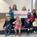 Staff and children at Rainbow Hub celebrate their Award