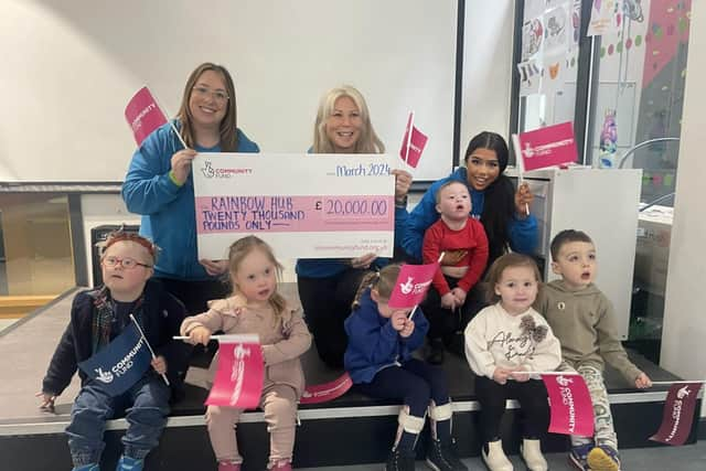 Staff and children at Rainbow Hub celebrate their Award