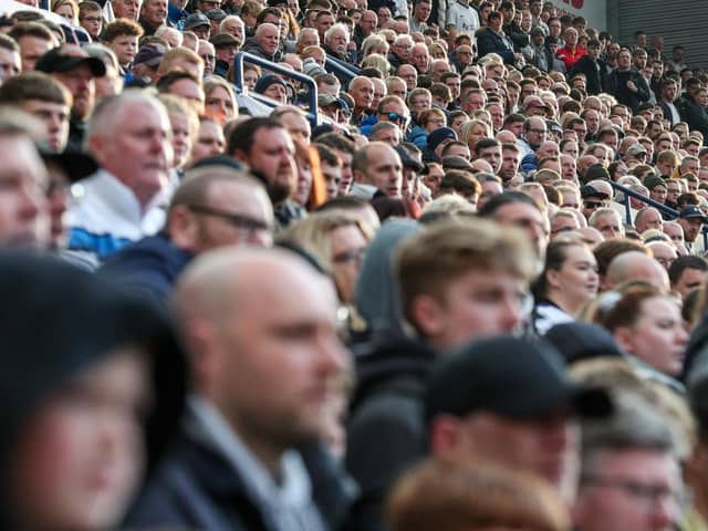Preston North End fans watch their team in action