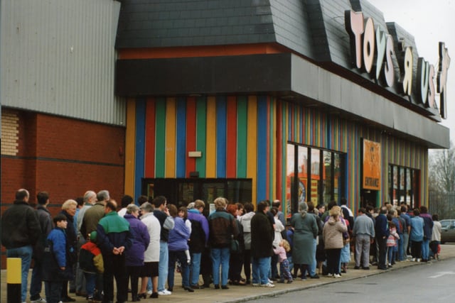 It is unclear what this huge queue of people outside Toys R Us was for. The picture was taken in November 1994. Anybody know?
