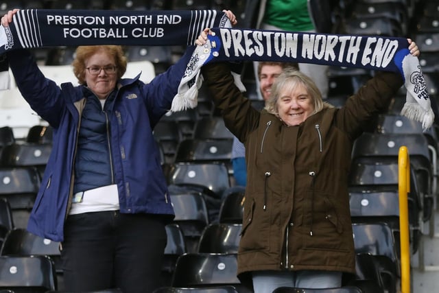 A pair of PNE fans pose with their scarves.