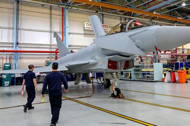 Staff assembling a Eurofighter Typhoon aircraft at BAE Systems' Warton plant in Lancashire