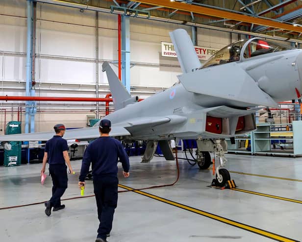 Staff assembling a Eurofighter Typhoon aircraft at BAE Systems' Warton plant in Lancashire