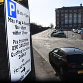 The pay and display sign in Pitt Street in Preston. County Hall is in the background