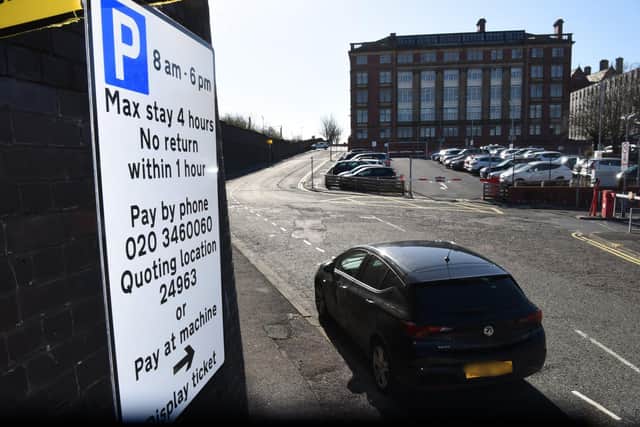 The pay and display sign in Pitt Street in Preston. County Hall is in the background