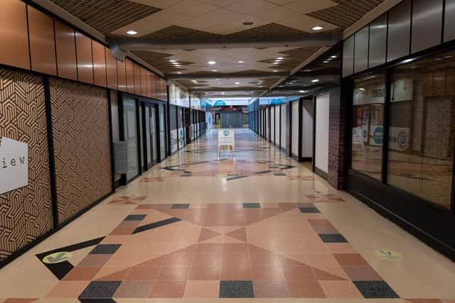 The ground floor shopping aracde has remained open throughout the legal proceedings - but several individual units are empty