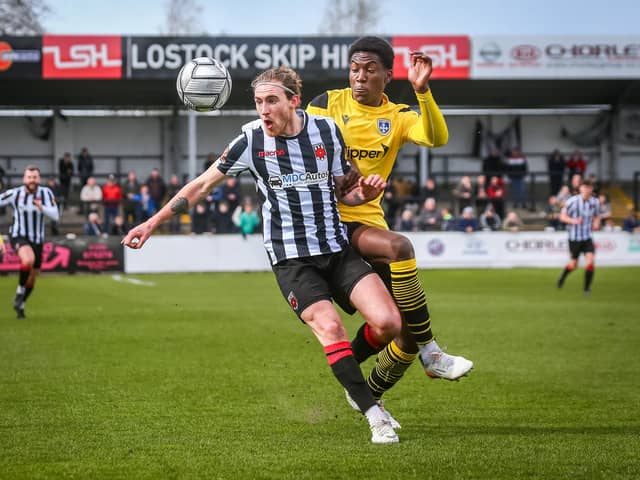 Magpies midfielder Billy Whitehouse protects the ball in the match against Guiseley Stefan willoughby